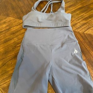 Ryderwear small woman sports bra and medium bottoms set.